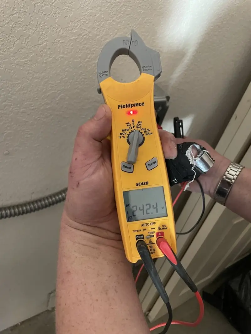 Voltage testing with clamp meter during Electrical Installation Services in Hillsborough